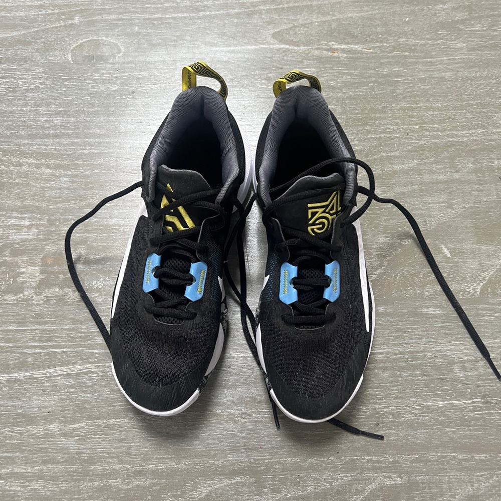Nike Men's Black Running Sneakers with Blue and Yellow Accents